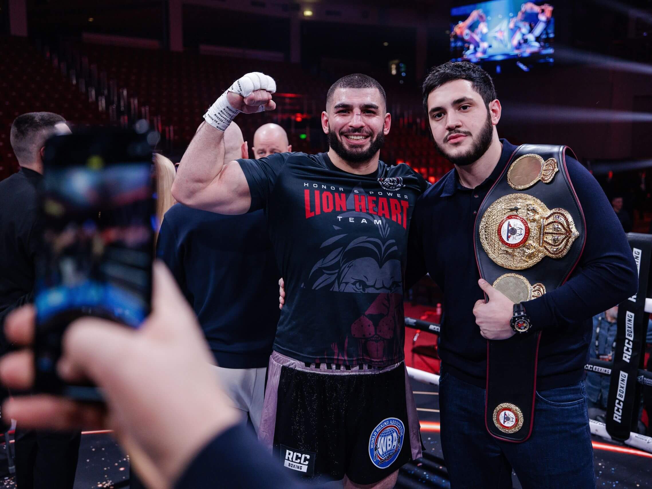 Portrait of RCC boxing champion Lion's Heart with the belt